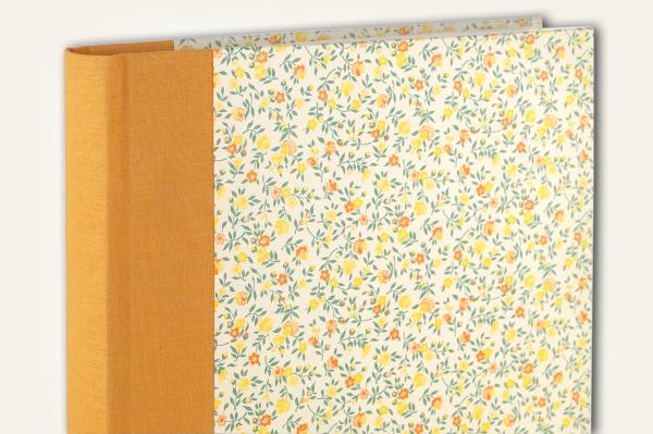 Yellow photo album, small floral decoration